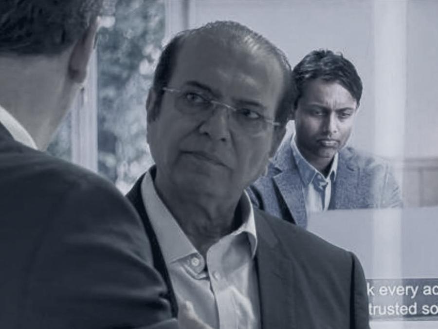 Ijaz Anwer in conversation at an industry exhibition stand